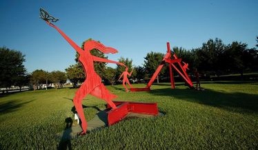 Metal Barn Sculpture in Open Area of Town Square Park